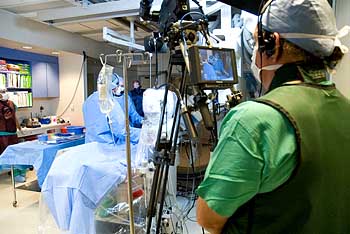 camera person shoots surgery for live audience