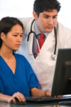 Nurse and doctor review medical record © UC Regents