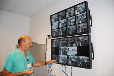 Dr. Schneider looks at screen in new OR suite © UC Regents