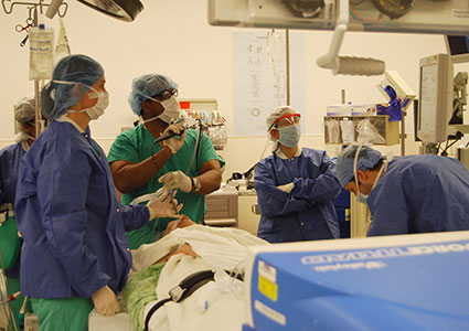 Dr. Cooke and his surgical team perform a bronchoscopy to view the lungs prior to initiating the surgery.