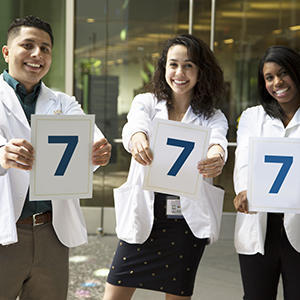 UC Davis School of Medicine students holding up the national ranking