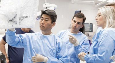 doctors using robotic surgery system