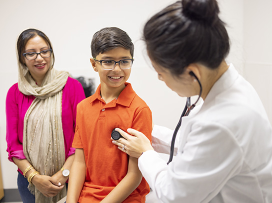 Physician and pediatric patient during an office visit