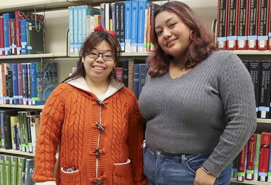 Redwood SEED Scholar Karis Chun (left) with student mentor Emily Gavidia at Shields Library