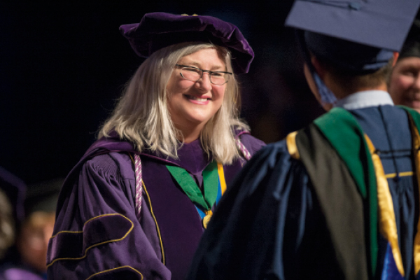 Heather M. Young at graduation ceremony