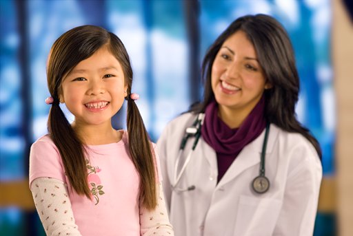 Doctor with young female patient (c) UC Regents