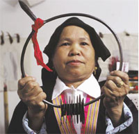 PHOTO -- In traditional Hmong culture, it is believed that illness occurs when the soul wanders from the body. Shamen, like Kang Thao, help call the soul home