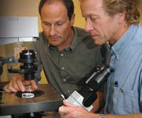 PHOTO — Thomas Huser (left) and Douglas Taylor use a breakthrough application  laser tweezers Ramen spectroscopy  to identify cancer cells earlier than conventional diagnostic methods.