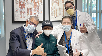 Pediatric orthopedic patient Darren with his surgeons