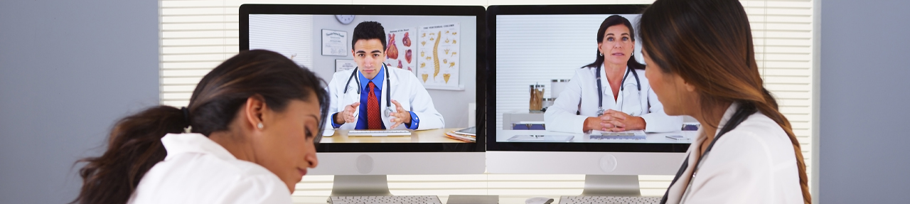 Four physicians collaborating via telementoring. (C) Adobe Stock. All rights reserved.