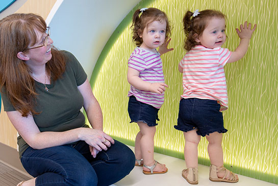 Twins Emily and Charlotte playing in playroom at UC Davis