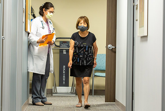 Physician and patient walking
