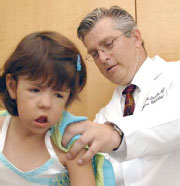 Dr. Craig McDonald with a patient