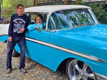 Recent surgery patient Martin Munson stands next to his wife, Sue, and his classic Chevrolet Bel Air. 