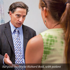Surgical oncologist Richard Bold, with patient